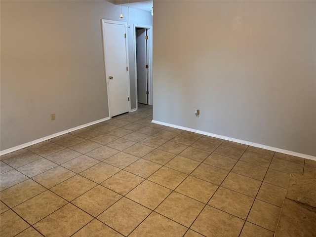 unfurnished room with light tile patterned floors