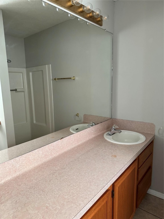 bathroom featuring vanity and tile patterned floors