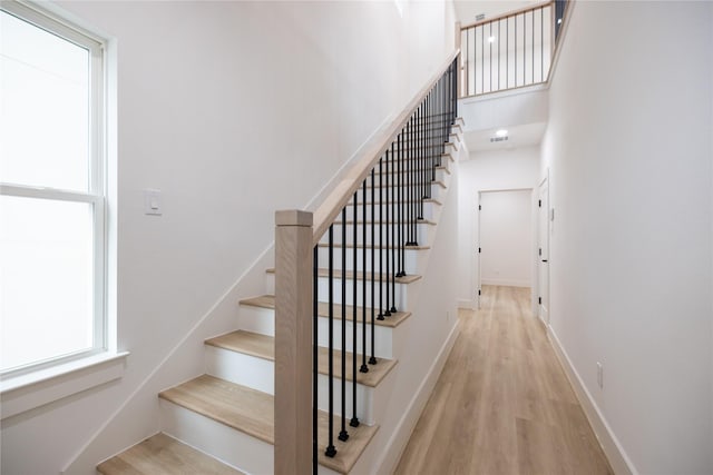 staircase featuring hardwood / wood-style flooring