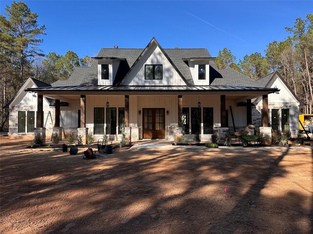 back of house with french doors and a porch