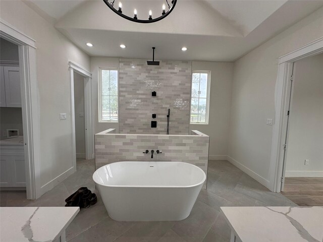 bathroom with vaulted ceiling, tile patterned flooring, and separate shower and tub