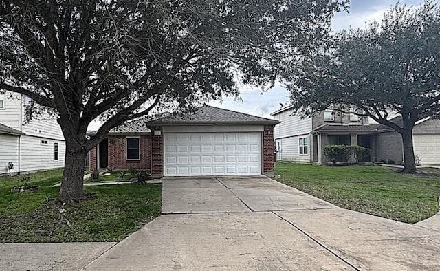 view of front of house featuring a front yard and a garage