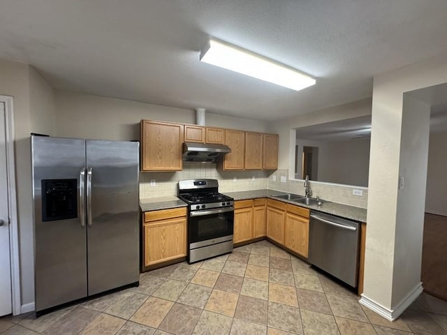 kitchen with backsplash, sink, and stainless steel appliances