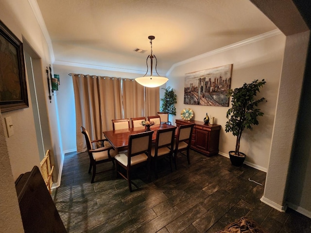 dining room featuring crown molding and dark hardwood / wood-style floors