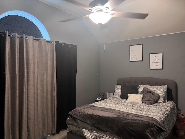 bedroom with ceiling fan and vaulted ceiling