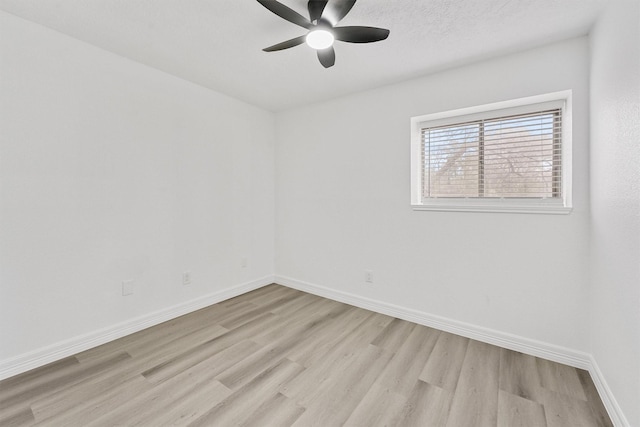 spare room featuring ceiling fan and light hardwood / wood-style flooring