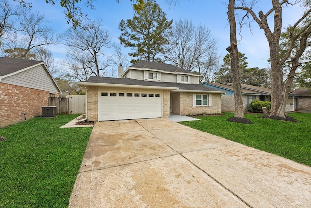 view of front of home featuring central air condition unit, a front yard, and a garage