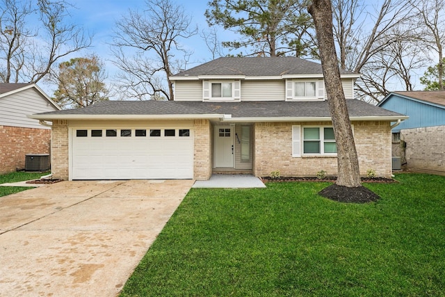 view of front of house featuring a front yard, a garage, and central air condition unit