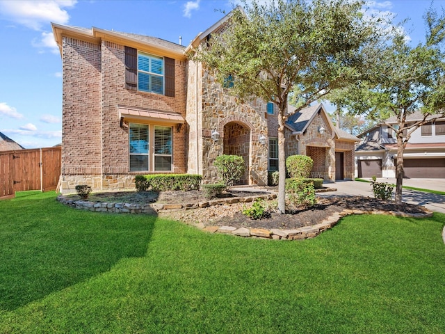 view of front facade featuring a garage and a front lawn