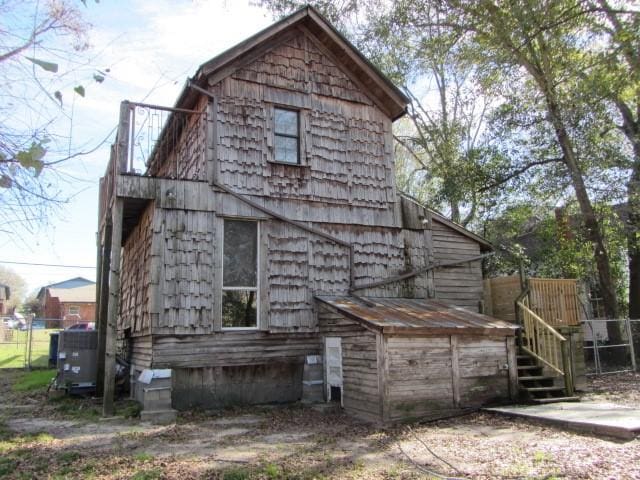 rear view of property with central air condition unit