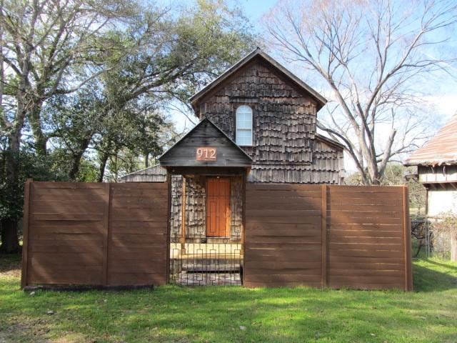 view of outbuilding with a lawn