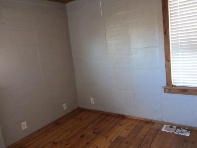 empty room featuring hardwood / wood-style flooring