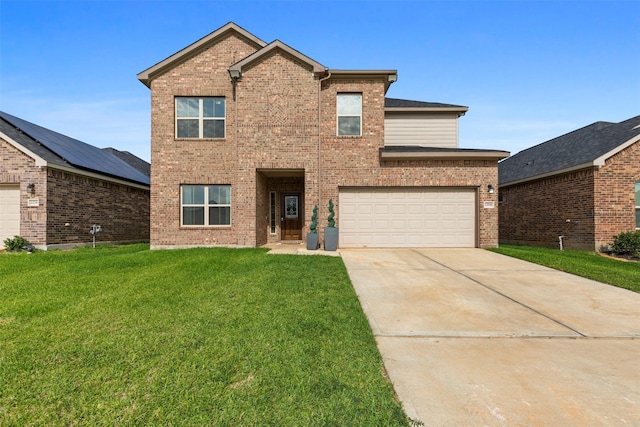 view of property featuring a garage and a front lawn