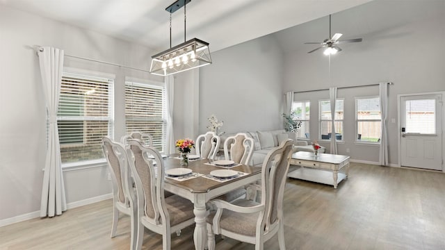 dining room with plenty of natural light, ceiling fan, and light hardwood / wood-style flooring