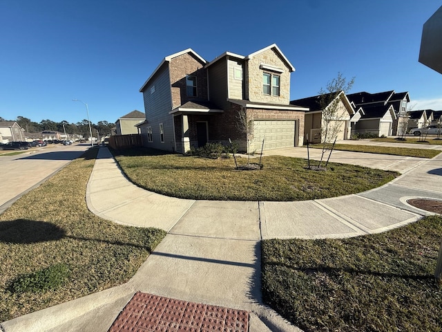 exterior space with a front yard and a garage