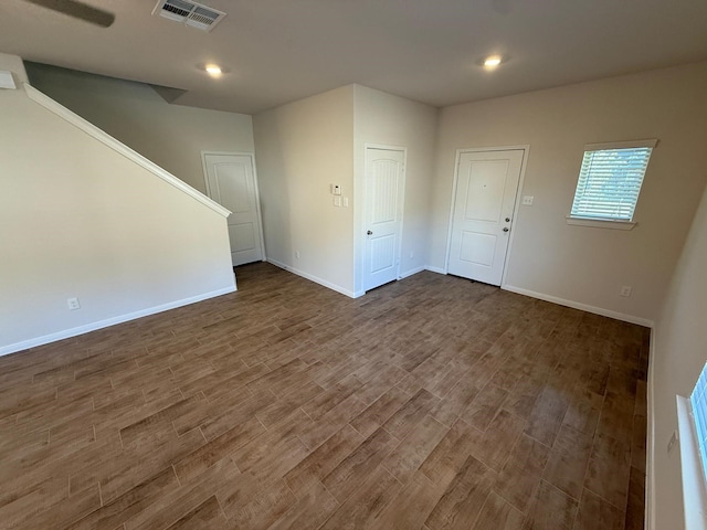 unfurnished room with dark hardwood / wood-style floors