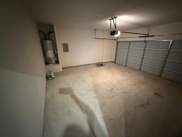 garage with electric panel, a garage door opener, and water heater