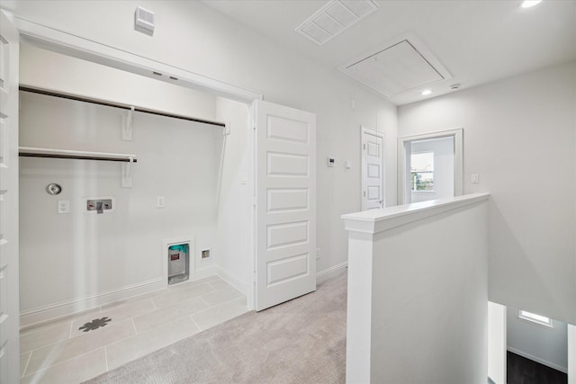 laundry room featuring hookup for a washing machine and light tile patterned flooring