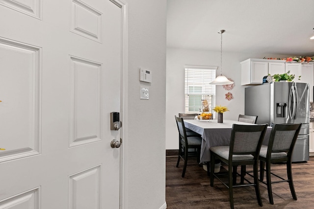 dining area featuring dark hardwood / wood-style floors