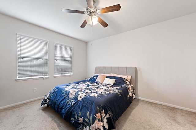 bedroom with light carpet and ceiling fan