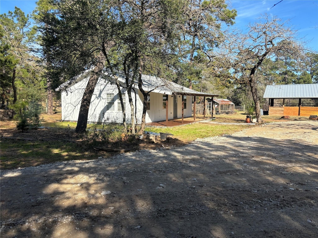 view of property exterior with an outbuilding