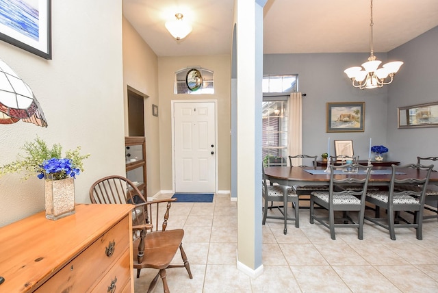 foyer entrance featuring light tile patterned flooring and a notable chandelier