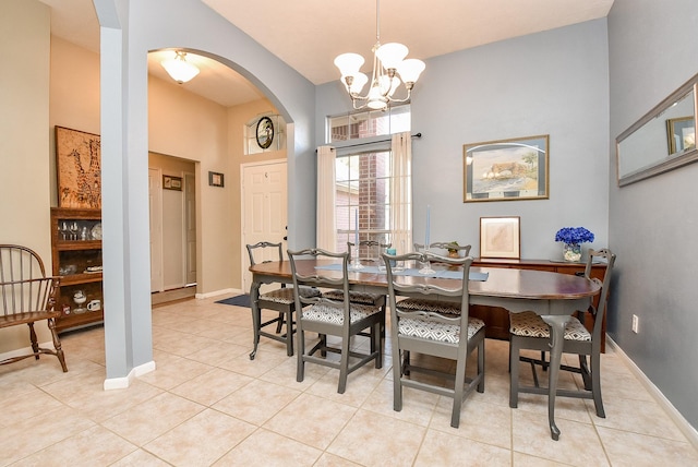 dining area featuring a chandelier and light tile patterned floors