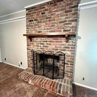 details with a brick fireplace