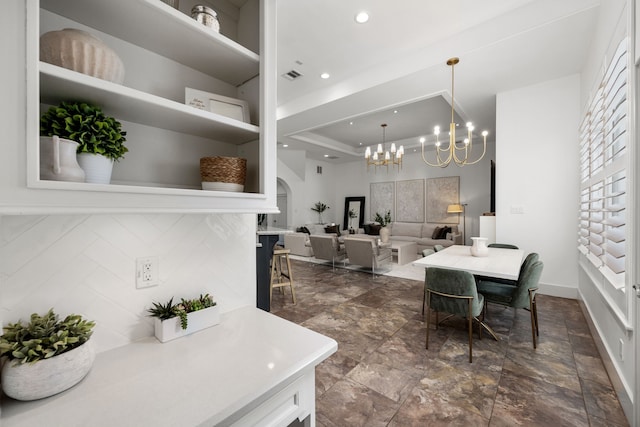 dining space with a chandelier