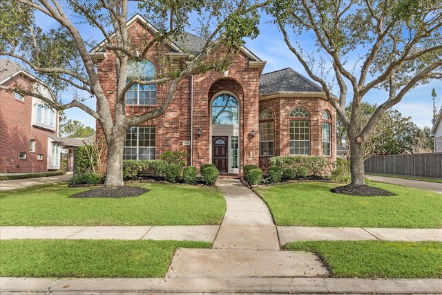 front facade with a front yard