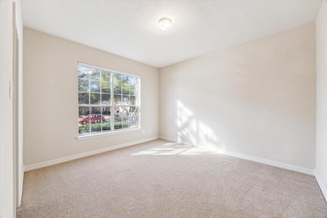 empty room with light colored carpet