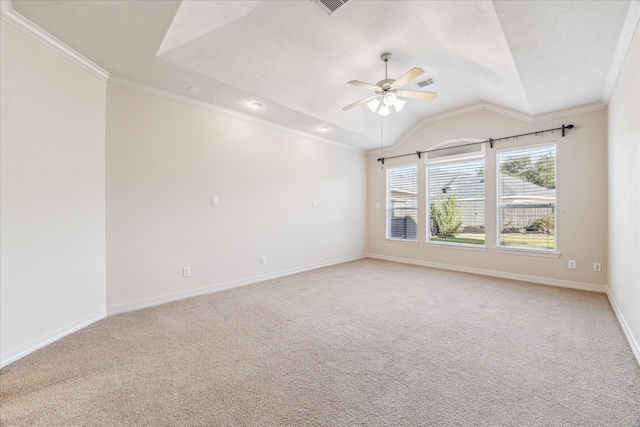 carpeted spare room with crown molding, ceiling fan, a raised ceiling, and vaulted ceiling