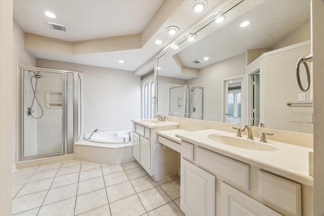 bathroom with tile patterned floors, plus walk in shower, and vanity