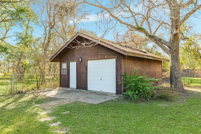 garage featuring a yard