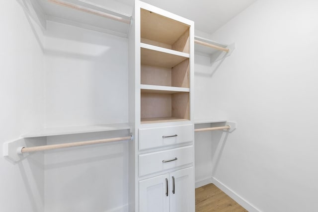 walk in closet featuring light wood-type flooring