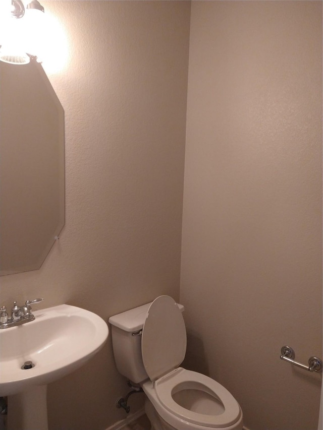 bathroom with sink and toilet