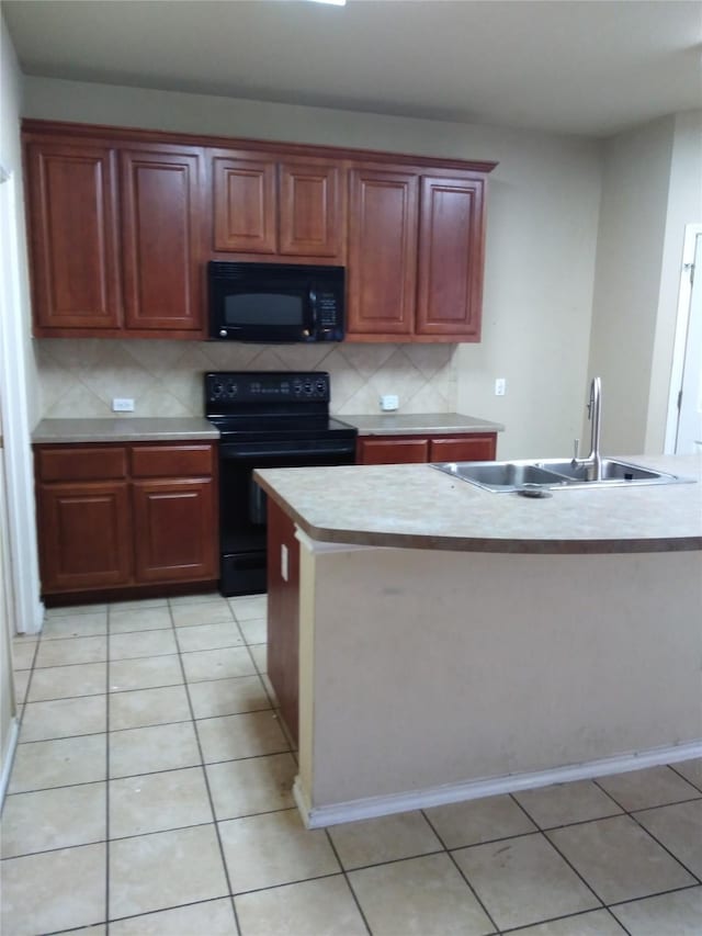 kitchen with black appliances, a center island with sink, sink, decorative backsplash, and light tile patterned floors