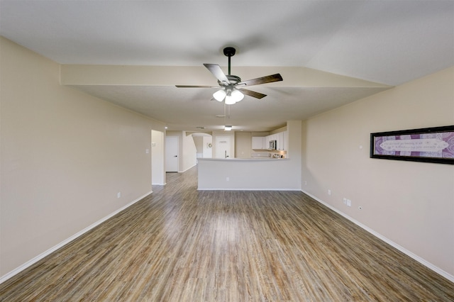 unfurnished living room with hardwood / wood-style flooring, ceiling fan, and lofted ceiling