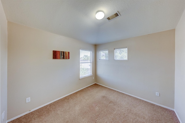 empty room with carpet flooring