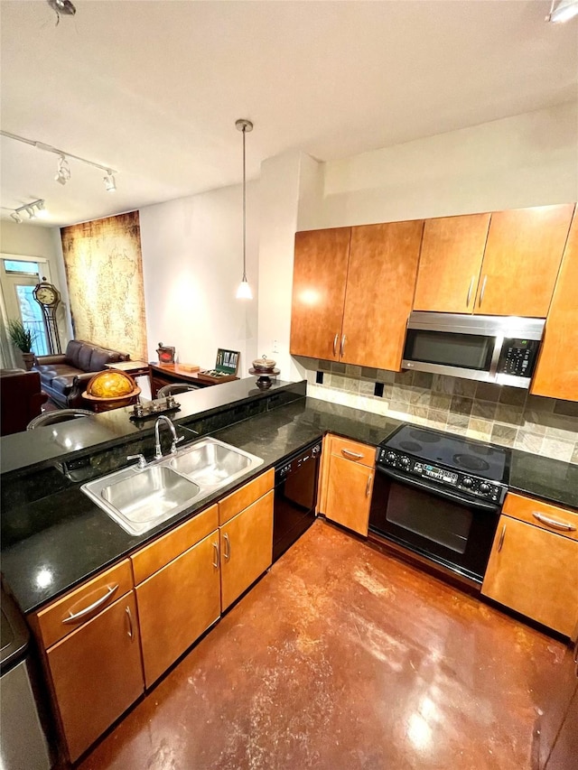 kitchen with black appliances, backsplash, sink, and pendant lighting