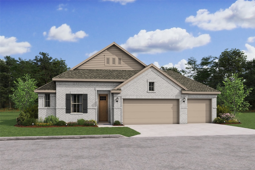 view of front of house featuring a front yard and a garage