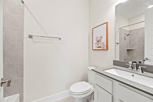 bathroom with tile patterned floors, vanity, toilet, and a tile shower