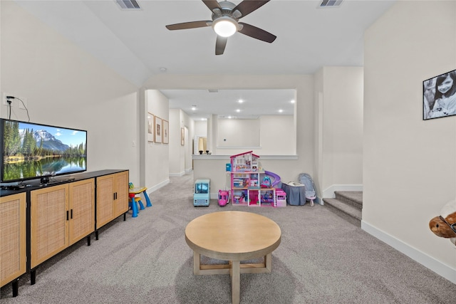 game room with light carpet and ceiling fan