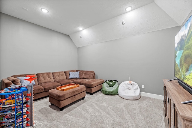 living room with light colored carpet, a textured ceiling, and vaulted ceiling