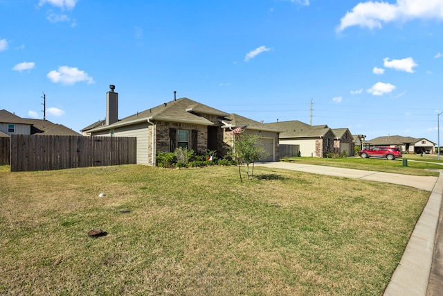 ranch-style house with a front lawn and a garage