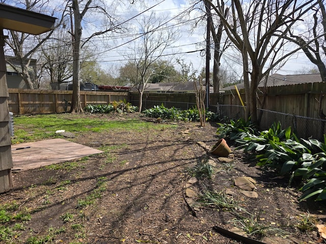 view of yard with a patio area and a fenced backyard