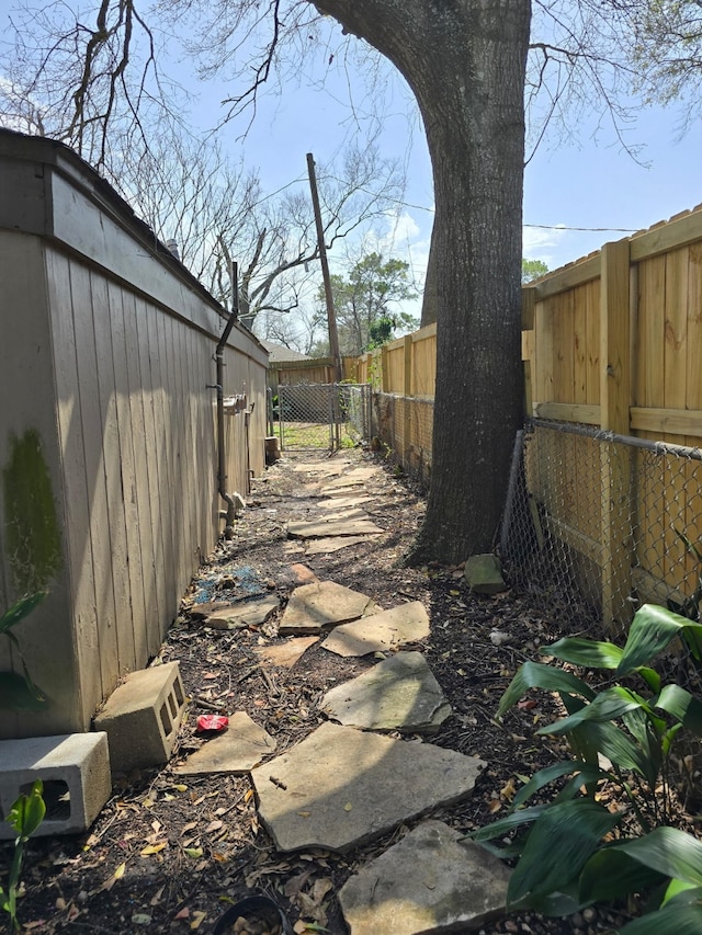 exterior space with a fenced backyard