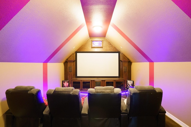 home theater featuring lofted ceiling