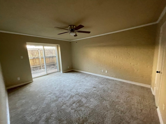 empty room with ceiling fan, carpet, and ornamental molding