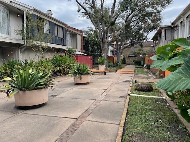 view of home's community with a patio area